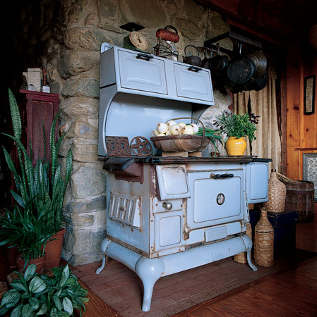 Kate’s collection of vintage tools, appliances, and other decor are all items that help create a wabi-sabi environment (see page 48) in her home. Kate uses the woodstove for baking, but in summer it doubles as counter space for her many garden-related projects.